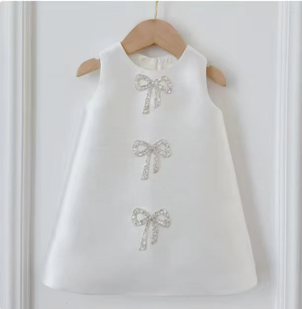 Sadie’s Satin & Bows Dress available in Pink or White