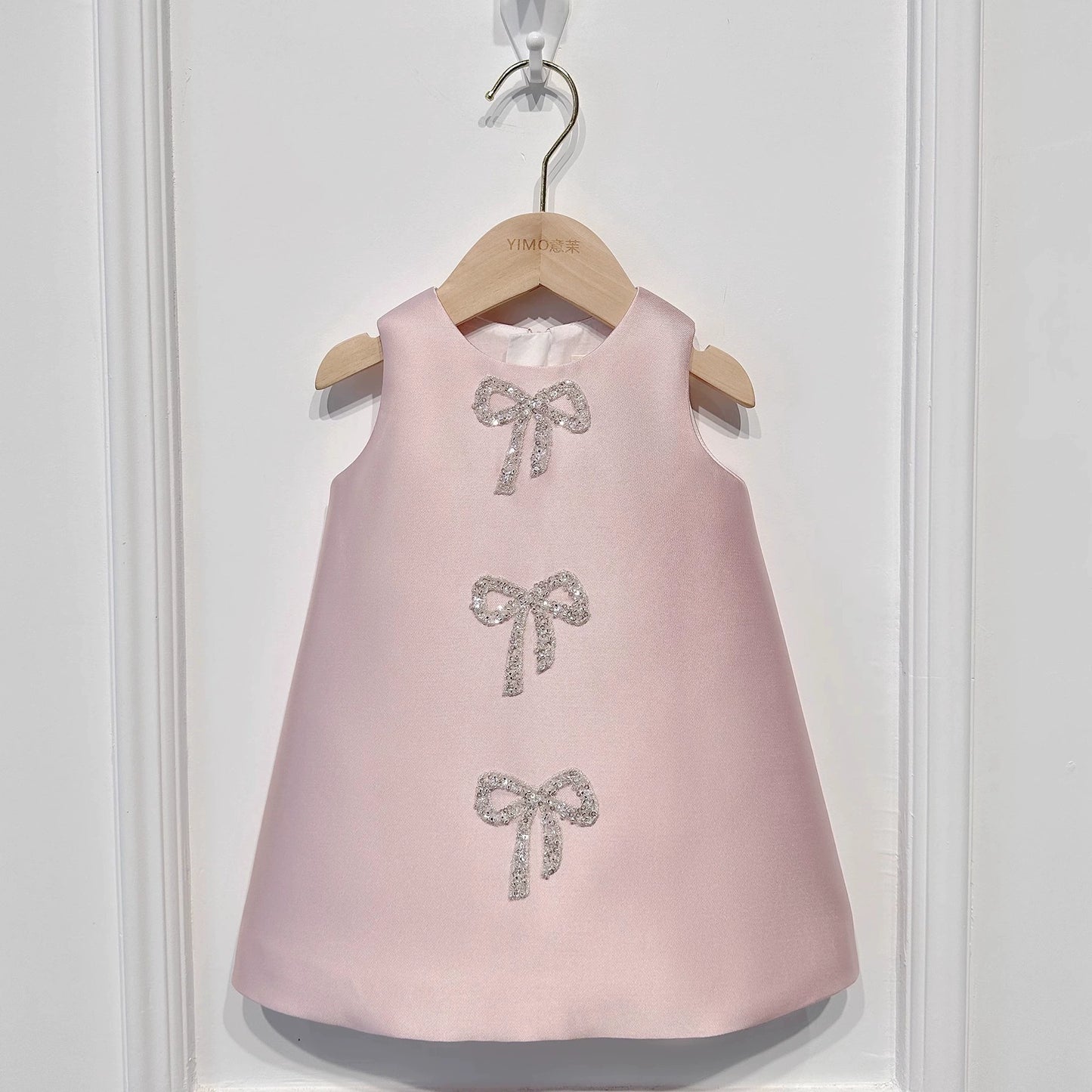 Sadie’s Satin & Bows Dress available in Pink or White