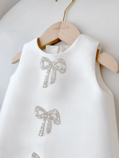Sadie’s Satin & Bows Dress available in Pink or White