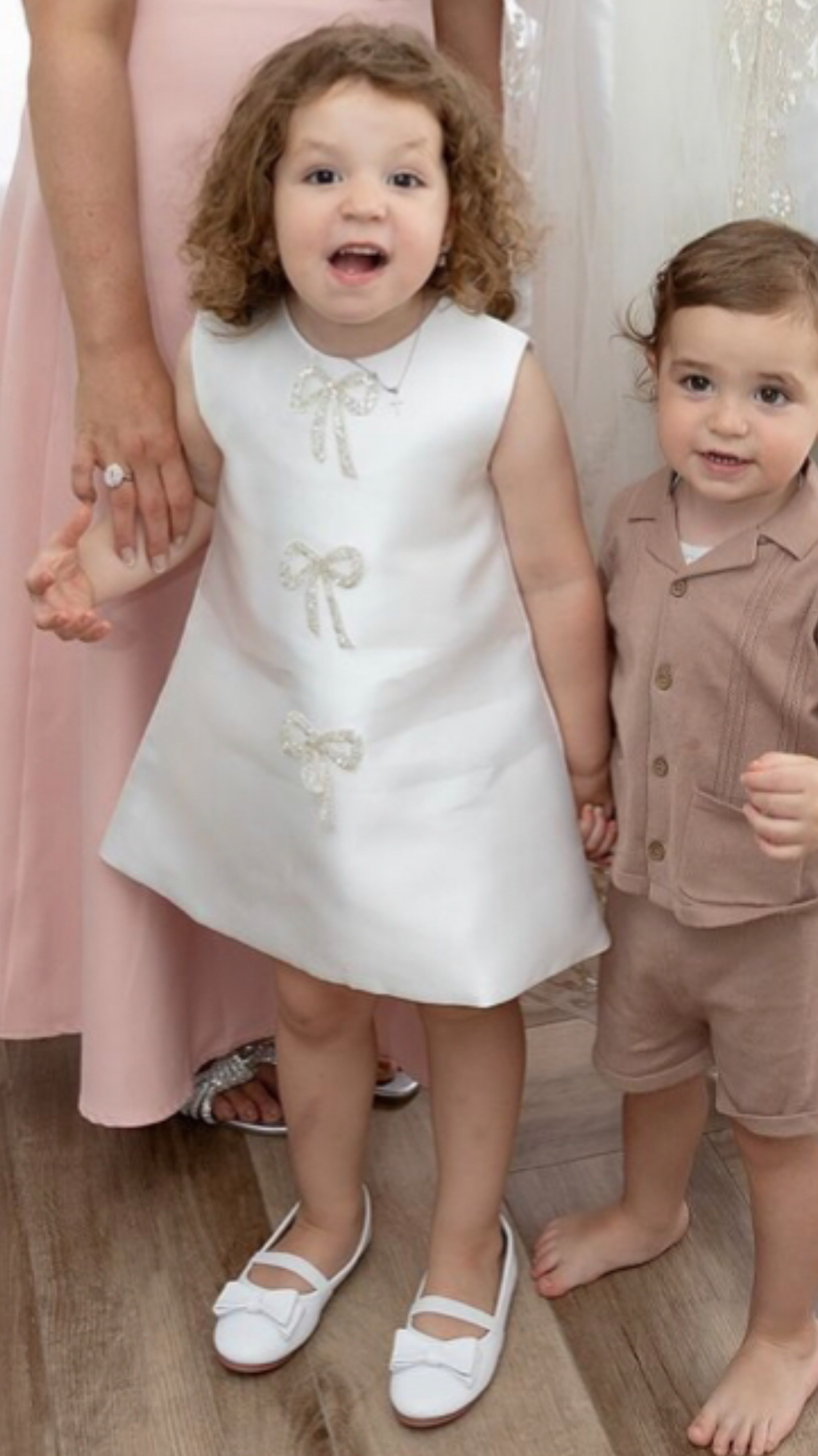 Sadie’s Satin & Bows Dress available in Pink or White